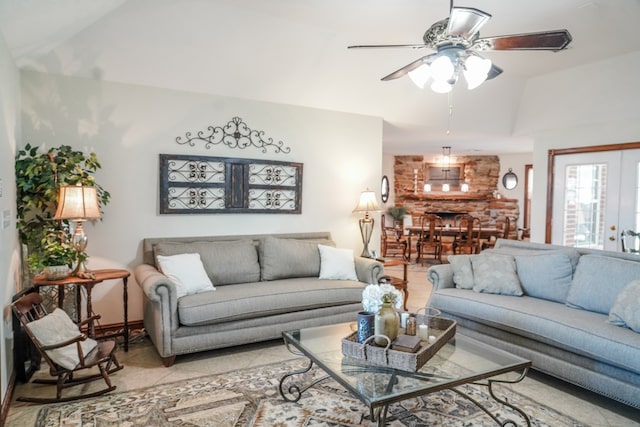 living room featuring ceiling fan, light tile patterned flooring, and vaulted ceiling