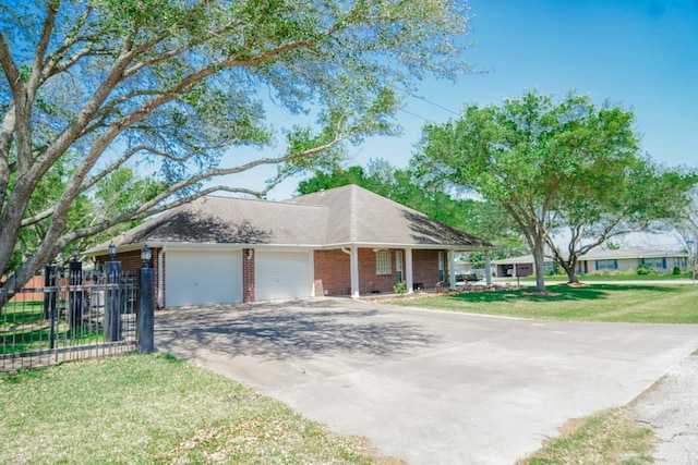 view of side of home featuring a garage and a lawn