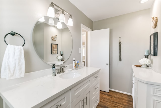 bathroom featuring vanity and hardwood / wood-style flooring