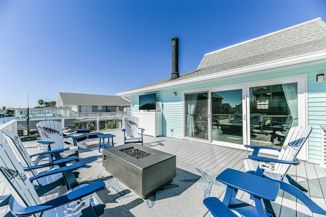 deck with an outdoor fire pit