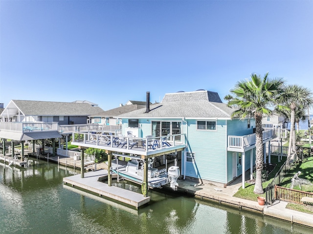 dock area with a balcony and a deck with water view