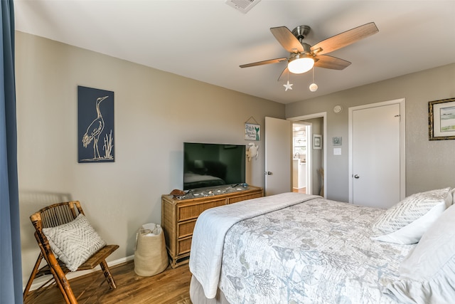 bedroom with wood-type flooring and ceiling fan