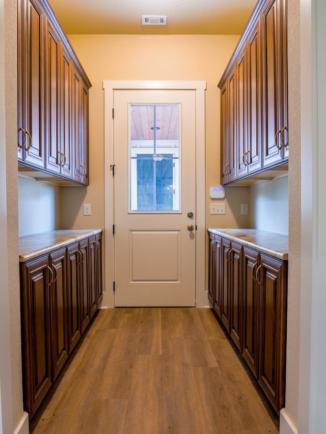 doorway to outside with light hardwood / wood-style floors