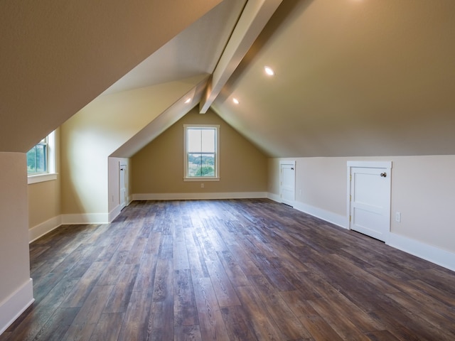 bonus room with vaulted ceiling with beams, dark hardwood / wood-style floors, and a healthy amount of sunlight