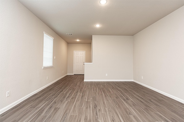 empty room featuring dark hardwood / wood-style floors