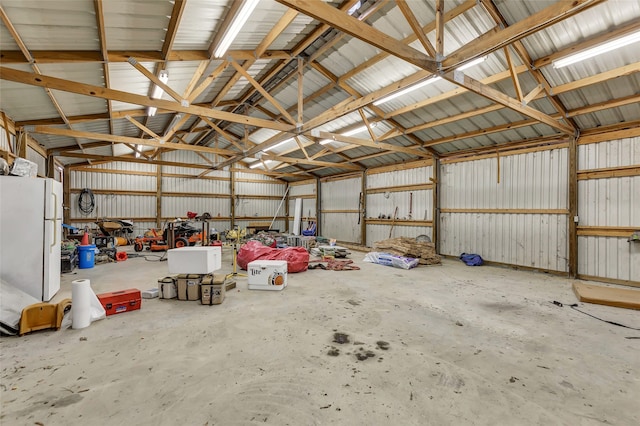 garage featuring white fridge