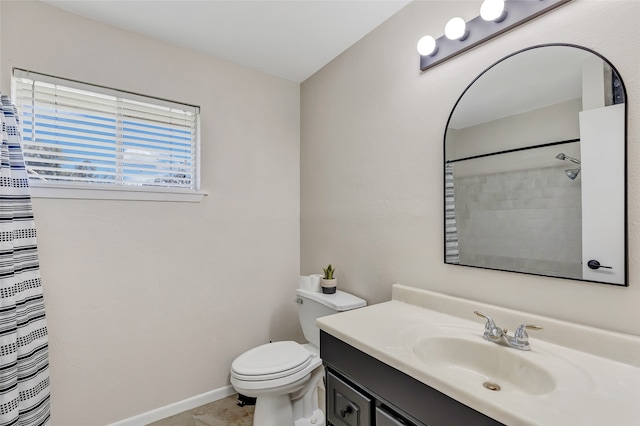 bathroom with vanity, curtained shower, toilet, and tile patterned flooring