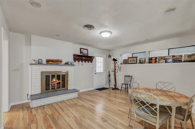 interior space with wood-type flooring and a fireplace