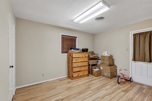 office space with light wood-type flooring