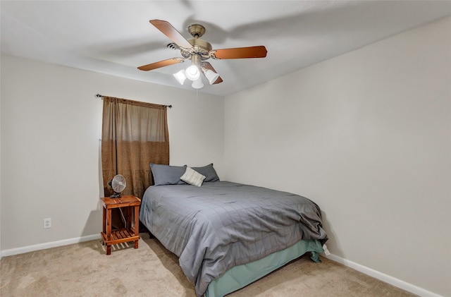 bedroom featuring light colored carpet and ceiling fan