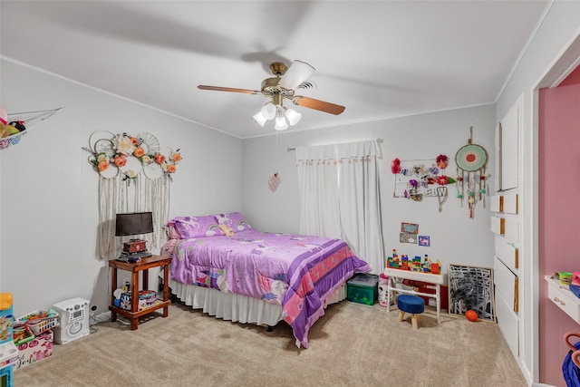 bedroom with ornamental molding, light colored carpet, and ceiling fan