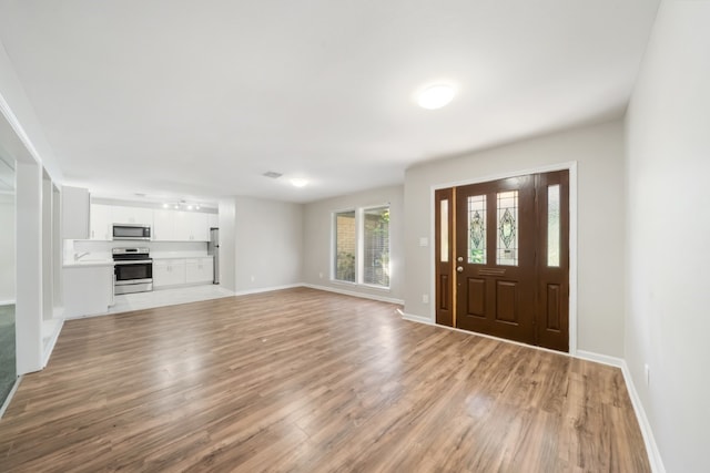 entrance foyer with light hardwood / wood-style flooring