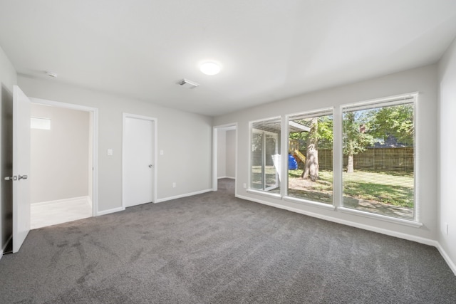 unfurnished room featuring carpet