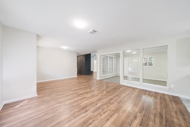 unfurnished living room with light hardwood / wood-style floors