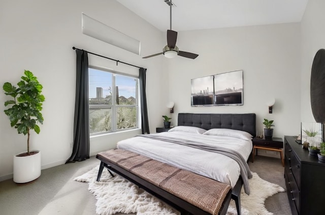 carpeted bedroom with ceiling fan and lofted ceiling