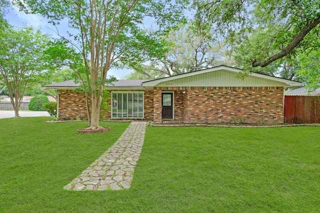 ranch-style house with a front yard