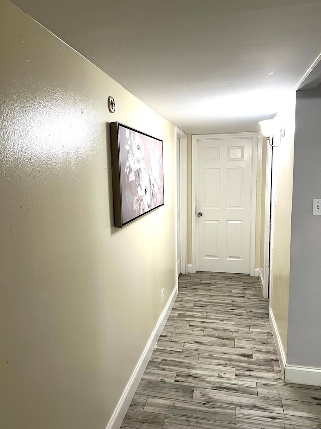 corridor featuring light hardwood / wood-style floors