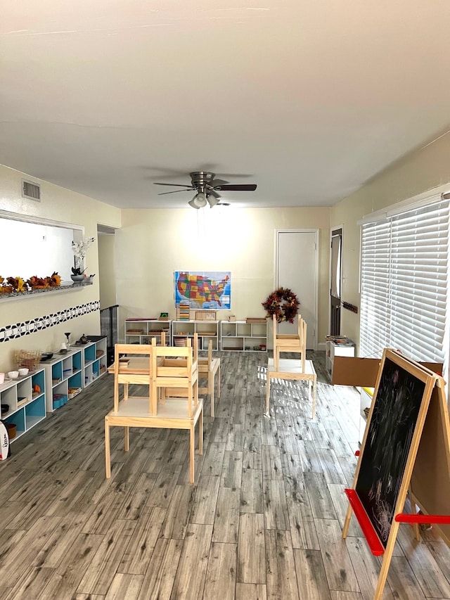 dining space with dark hardwood / wood-style floors and ceiling fan