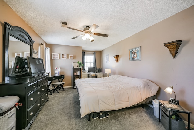 carpeted bedroom featuring a textured ceiling and ceiling fan