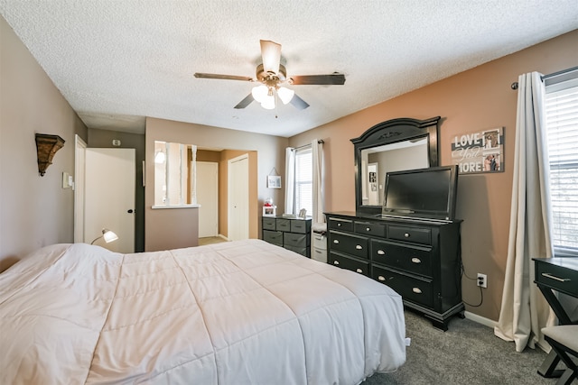 bedroom with ceiling fan, a textured ceiling, and carpet floors