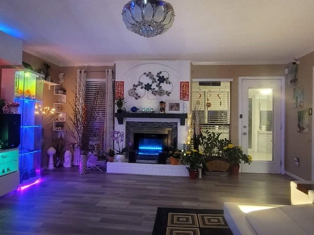 living room with wood-type flooring and a fireplace