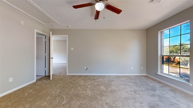 unfurnished room with light carpet and ceiling fan