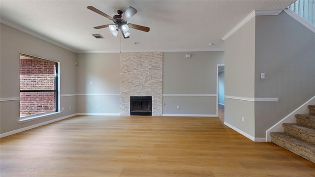 unfurnished living room featuring ornamental molding, light hardwood / wood-style flooring, and ceiling fan