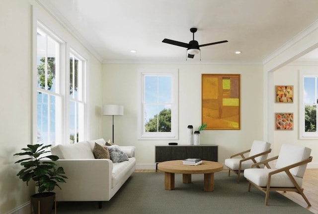 sitting room featuring crown molding, wood-type flooring, and ceiling fan