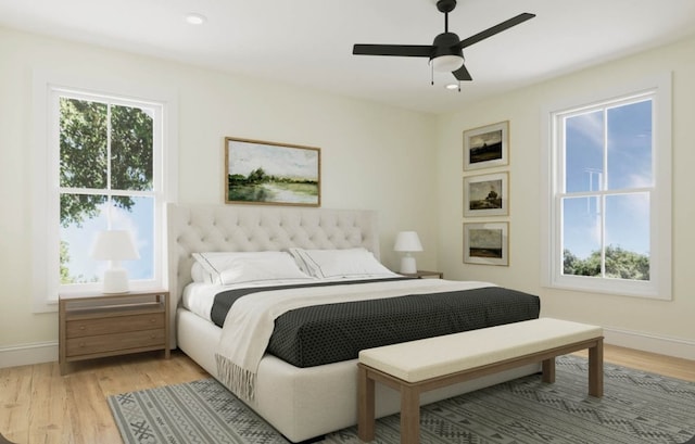 bedroom with light hardwood / wood-style flooring, multiple windows, and ceiling fan