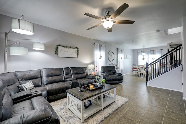 tiled living room with ceiling fan