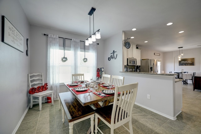 dining room featuring light tile patterned floors