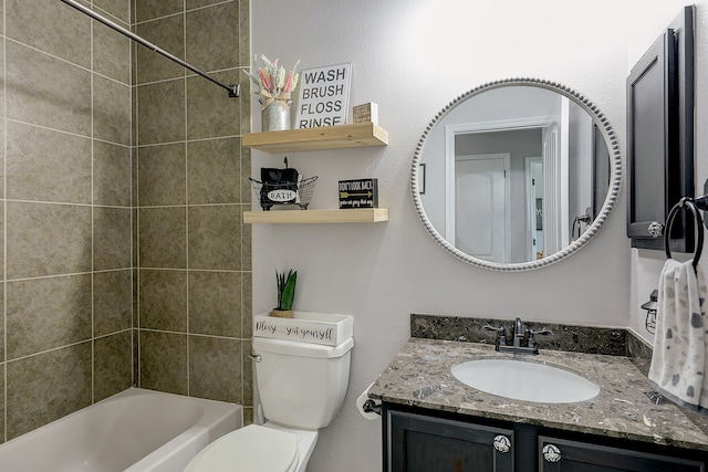 full bathroom featuring vanity, toilet, and tiled shower / bath