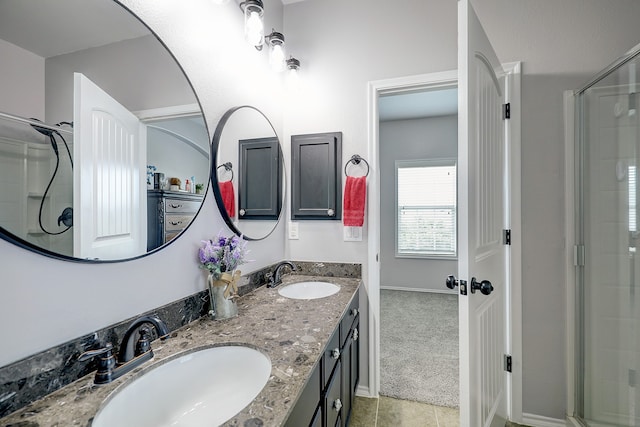 bathroom featuring vanity, walk in shower, and tile patterned flooring