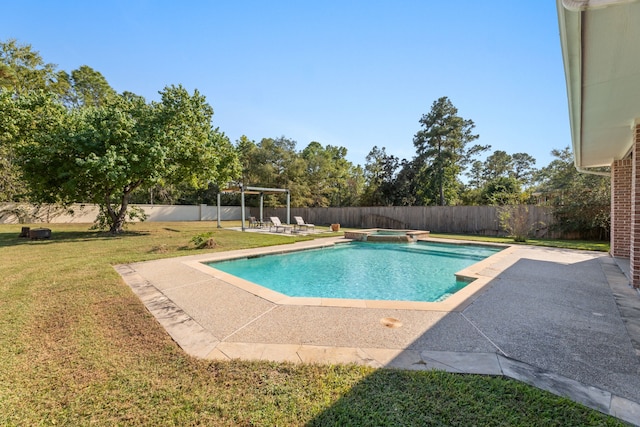 view of pool with a patio and a lawn