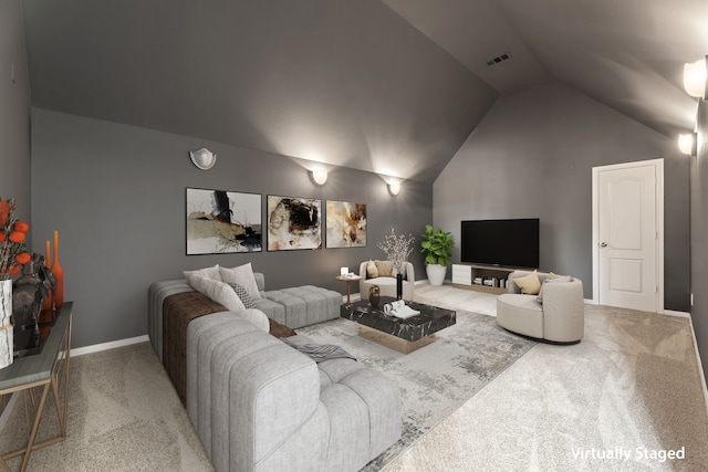 living room with lofted ceiling and carpet