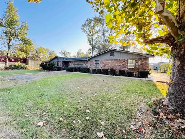 view of property exterior with a yard