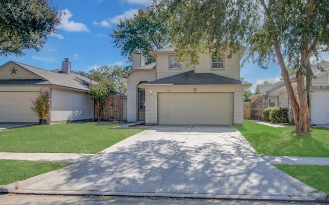 view of property featuring a front lawn and a garage