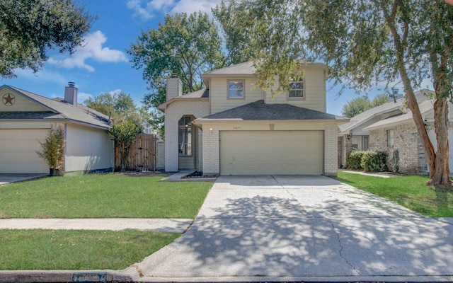 view of property featuring a front yard and a garage