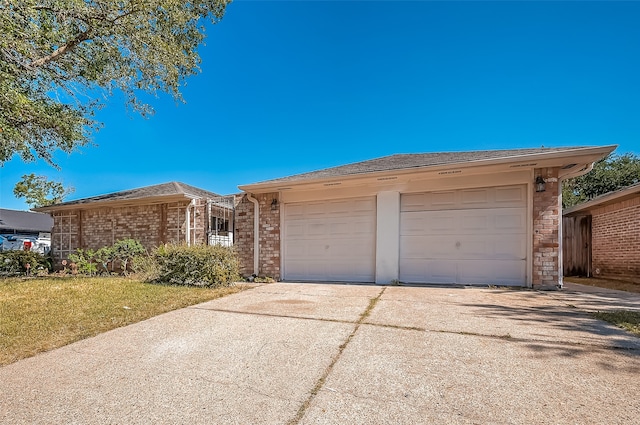 ranch-style home featuring a garage