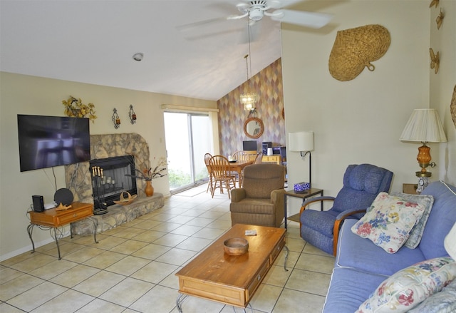 tiled living room with ceiling fan, a fireplace, and lofted ceiling