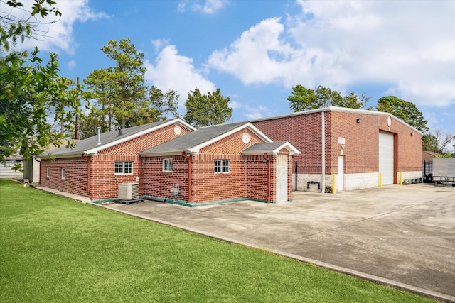 11126 Timber Crest Dr, Houston, TX 77065 - view of home's exterior with brick siding, a yard, a garage, and central AC