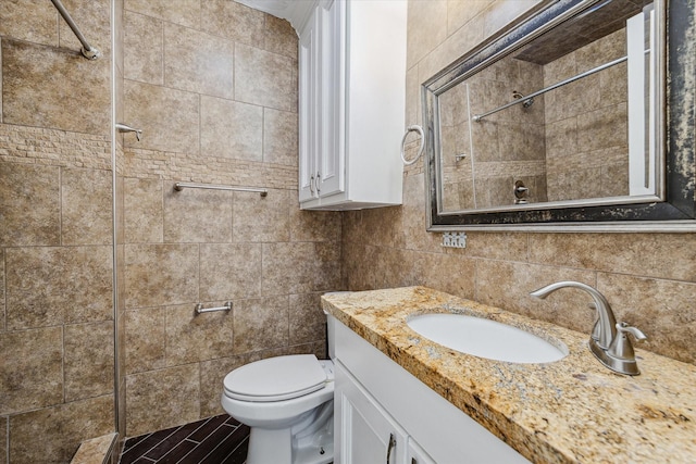 11126 Timber Crest Dr, Houston, TX 77065 - full bath with tile walls, toilet, vanity, a tile shower, and backsplash