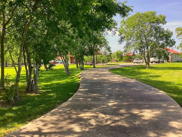 surrounding community featuring a lawn