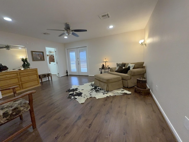 sitting room featuring french doors, ceiling fan, and dark hardwood / wood-style flooring