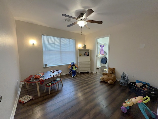 playroom with dark hardwood / wood-style floors and ceiling fan