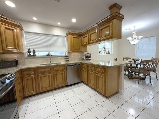 kitchen with light tile patterned flooring, decorative light fixtures, sink, kitchen peninsula, and stainless steel appliances