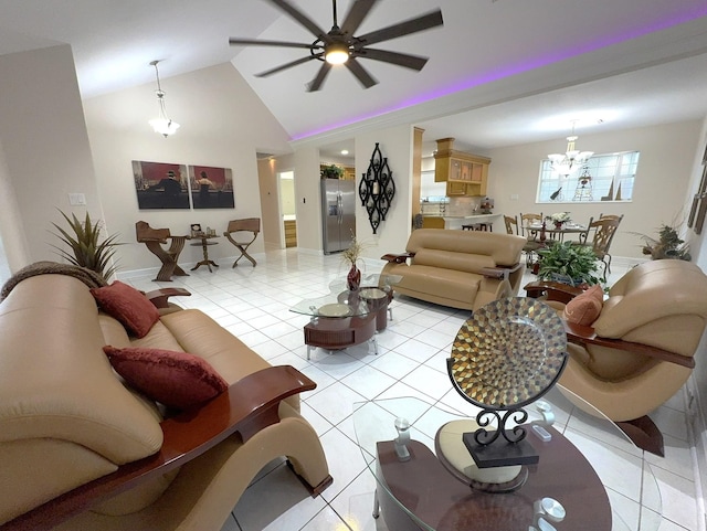 living room with ceiling fan with notable chandelier, lofted ceiling, and light tile patterned floors