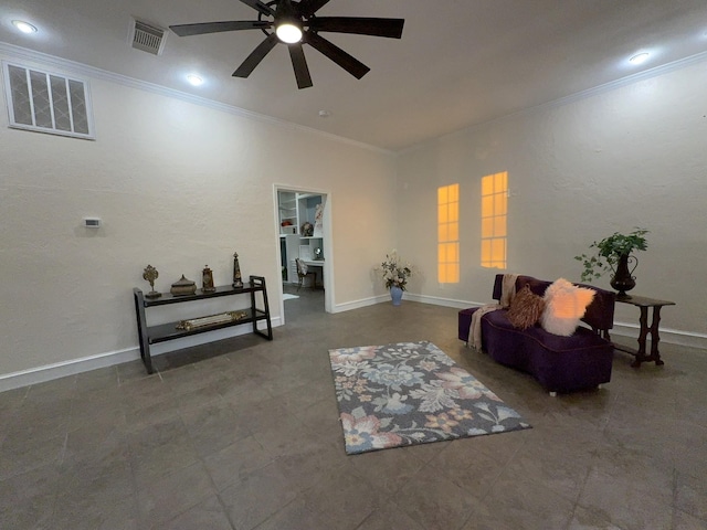 sitting room featuring ornamental molding and ceiling fan