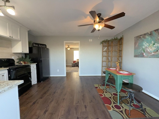 kitchen featuring dark hardwood / wood-style floors, white cabinetry, decorative backsplash, ceiling fan, and black appliances