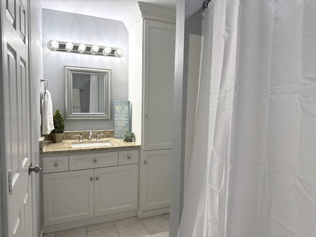 bathroom featuring vanity and tile patterned flooring